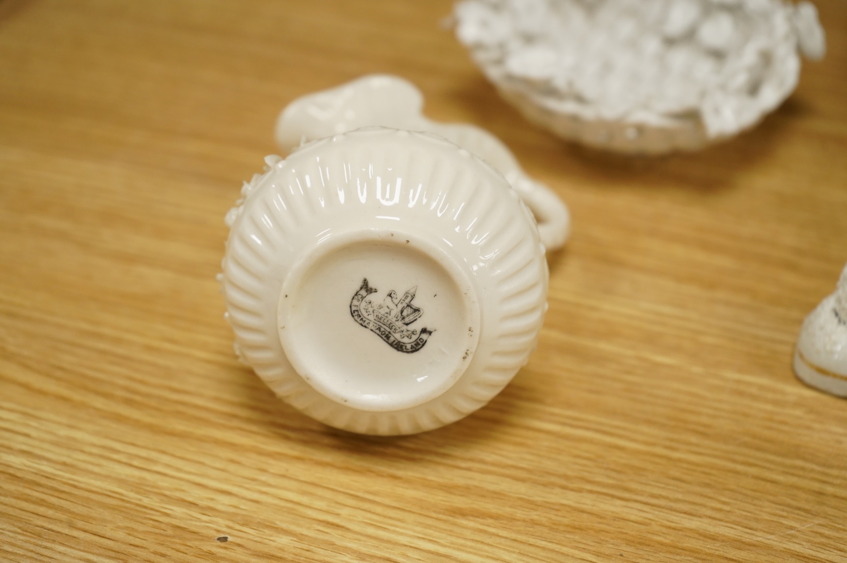 A set of six early 19th century English porcelain plates, impressed anchor mark, Belleek ewer, and other items (15)